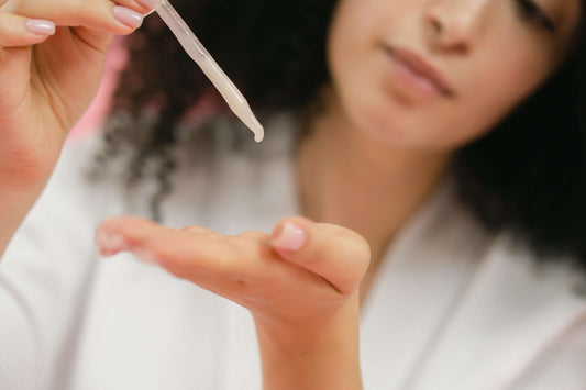 Woman with serum syringe – symbolising exosome treatments and their controversy in aesthetic medicine
