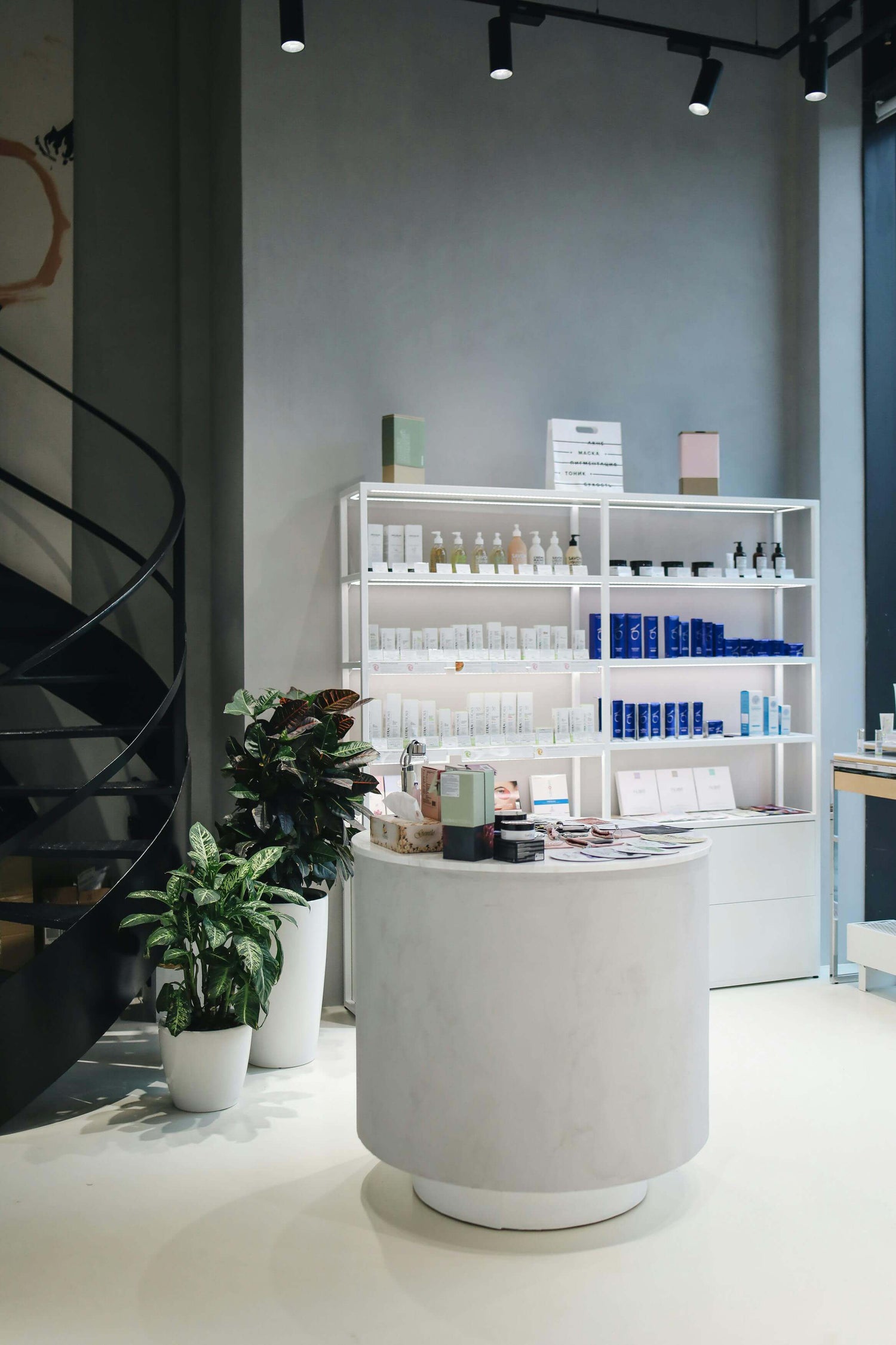 Shelf stocked with medical-grade skincare products in a clinical setting
