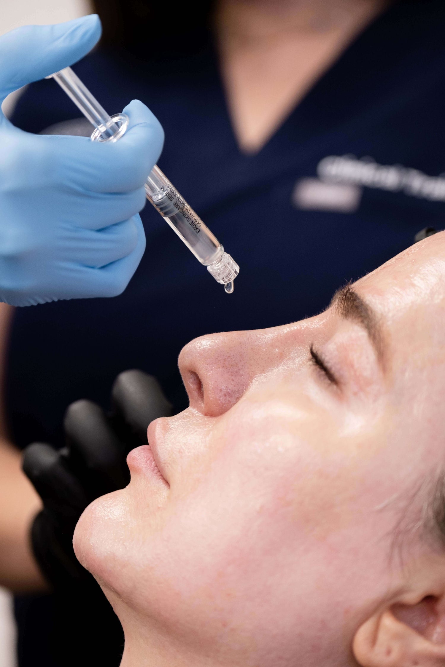 Clinician applying EXO|E in a treatment setting – expert use of exosome-based therapy